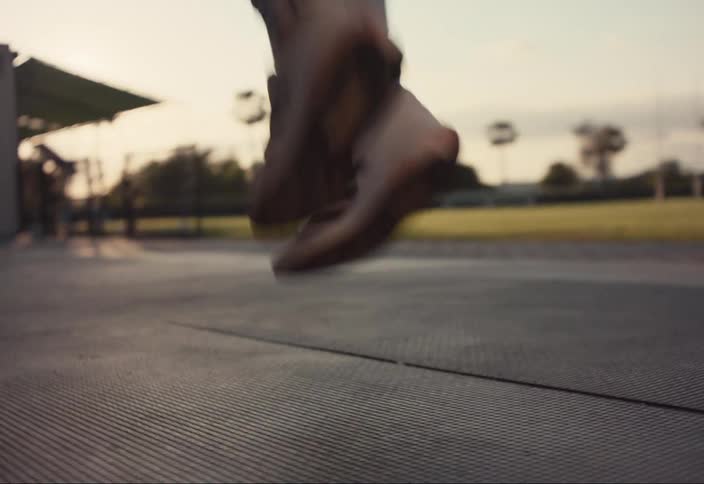 Woman runs in place doing warm up exercises