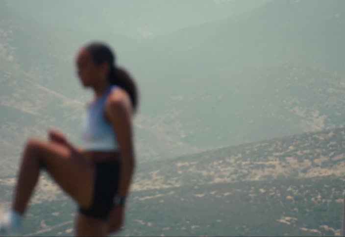 A woman is working out in the sun