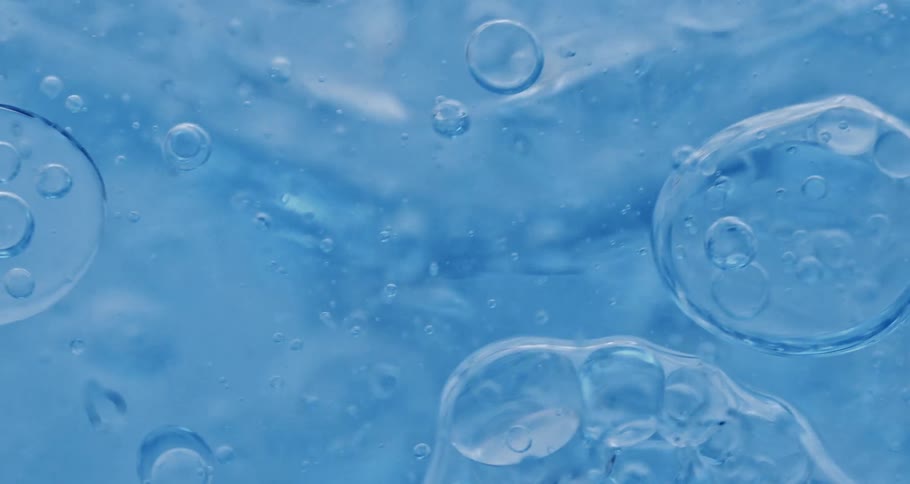 Liquid dense and abstract blue bubbles falling