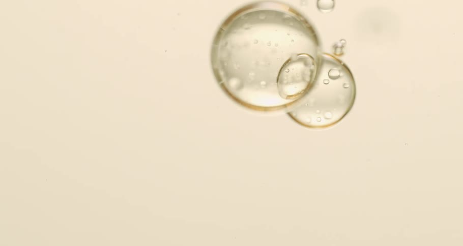 Air bubbles float down a clear liquid