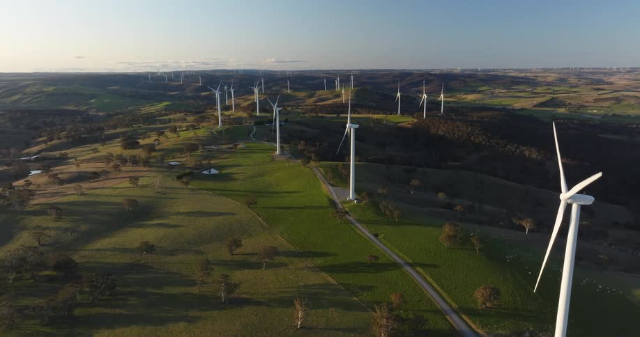 Aerial view of moving wind energy platforms in a field