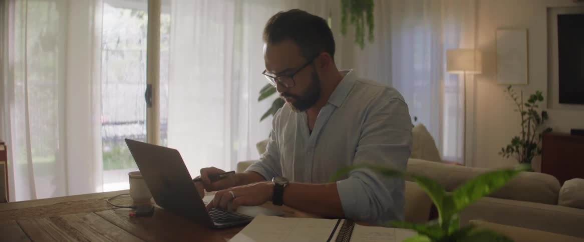 A man working at home on the computer