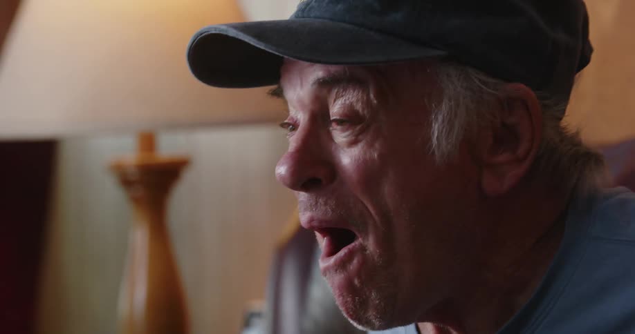 A man is cheering at home
