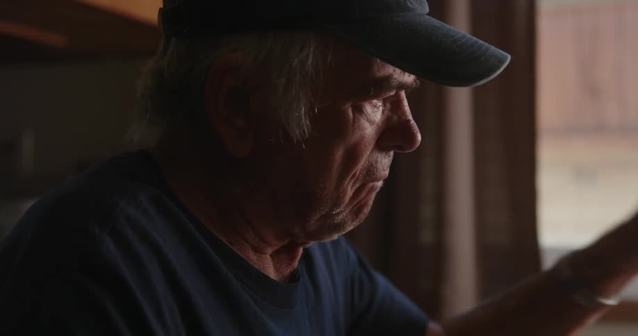 Portrait of an elderly person looking somewhat irritated