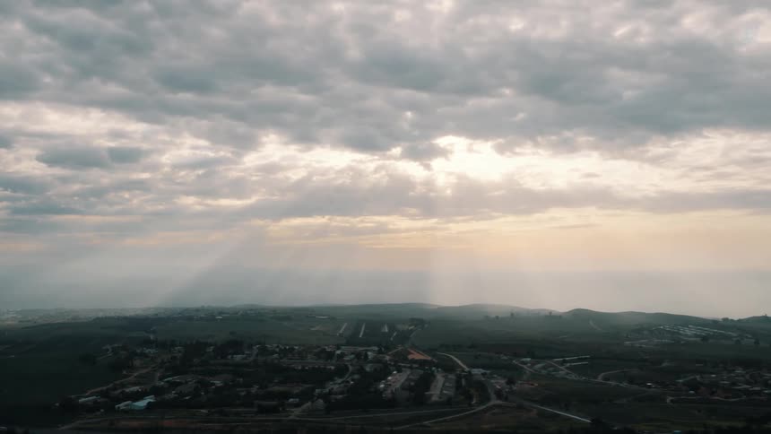 The suburbs are under heavy clouds