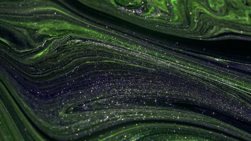 green paint flows across the screen in a complex texture with thin lines