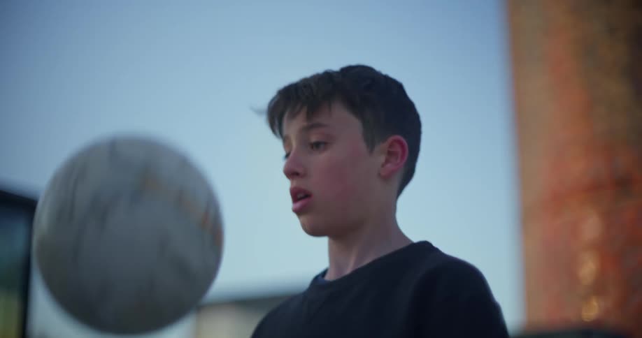 A boy plays with a soccer ball