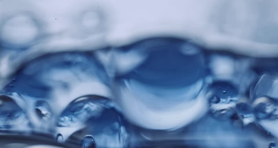 Abstract transparent liquid with moving spheres