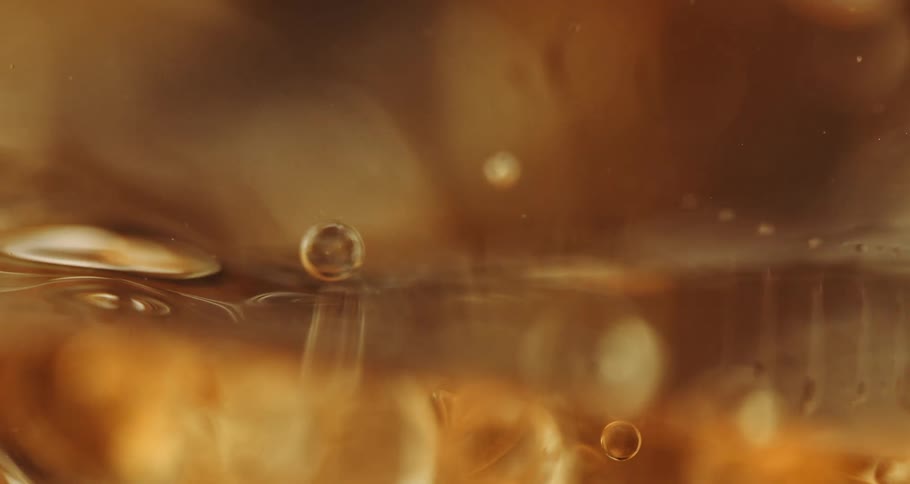 A golden fluid with many bubbles