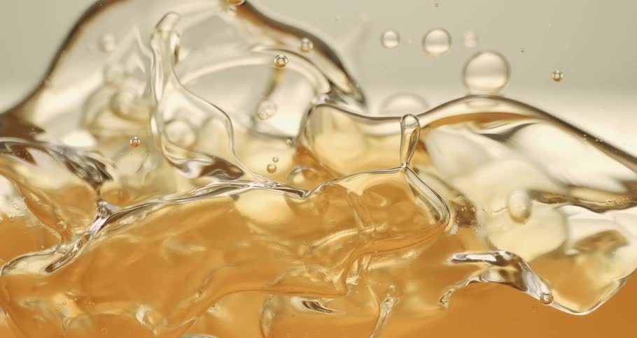 Abstract viscous liquid in motion generating bubbles