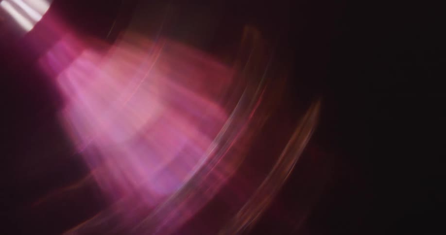 Effects of lens flares from abstract lights on a black background