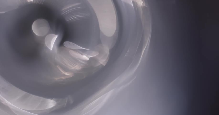 Abstract white light reflections on a circular object