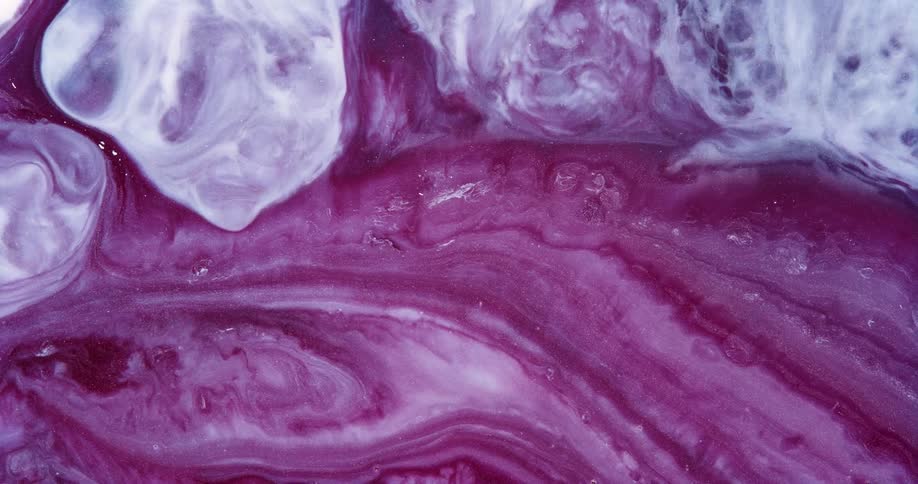 Dense and abstract liquid with boiling texture in pink and white