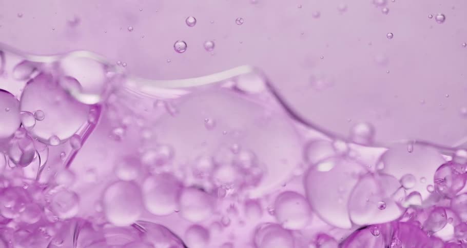 Purple liquid with abstract bubbles in motion
