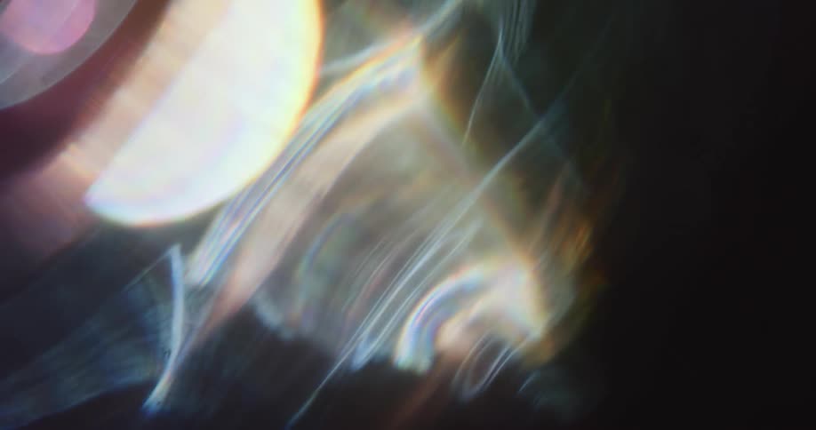 Effects of lens flares from abstract lights on a black background