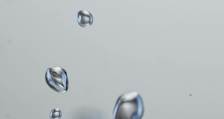 Bubbles are floating and flying in a clear liquid