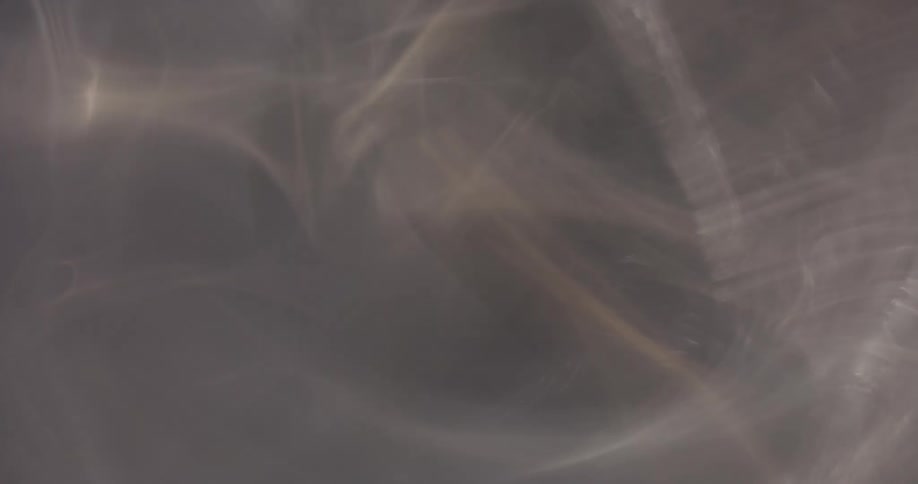 Reflection of light flares against a black background