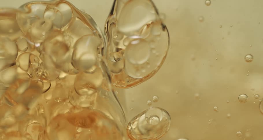 The gold liquid splashes around