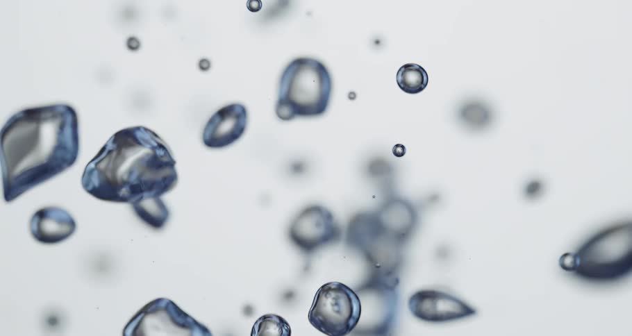 Air bubbles float up and down clear water