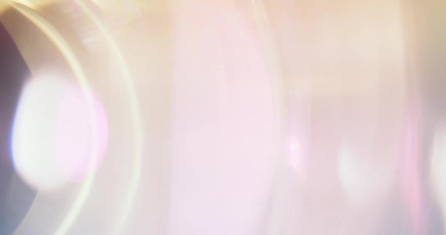 Several roundshaped beams of light passing through a dark environment