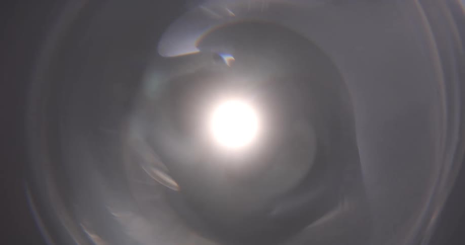 Reflection of light flares against a black background