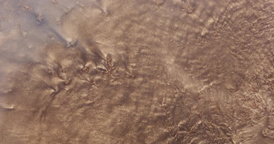 The sand moves around in waves