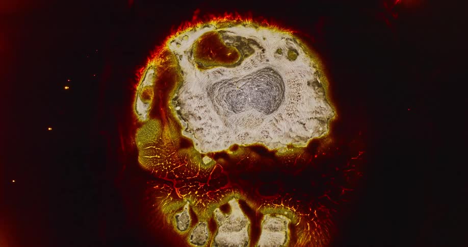 Red and yellow magma like flow flare up and break