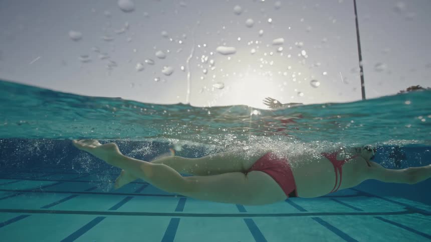 A woman swims in a pool