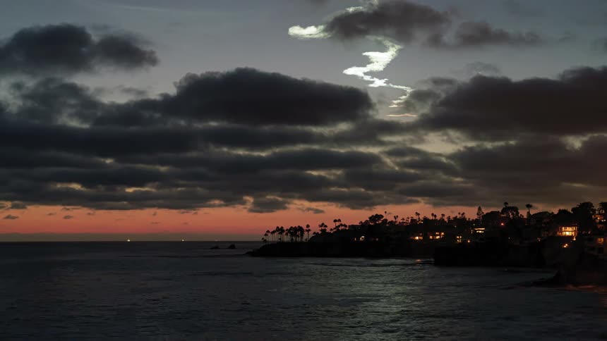 Clouds over a coastal town at evening