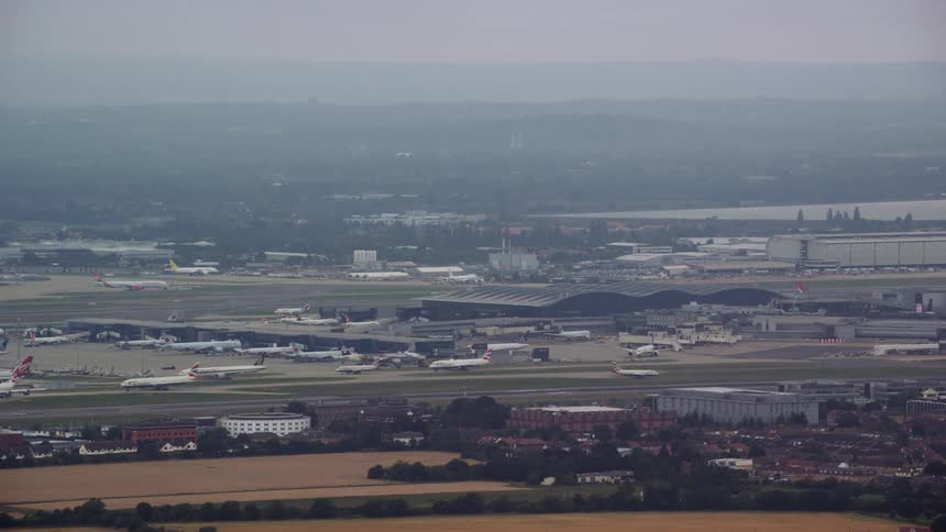Haze covers horizon heavily and airport lightly