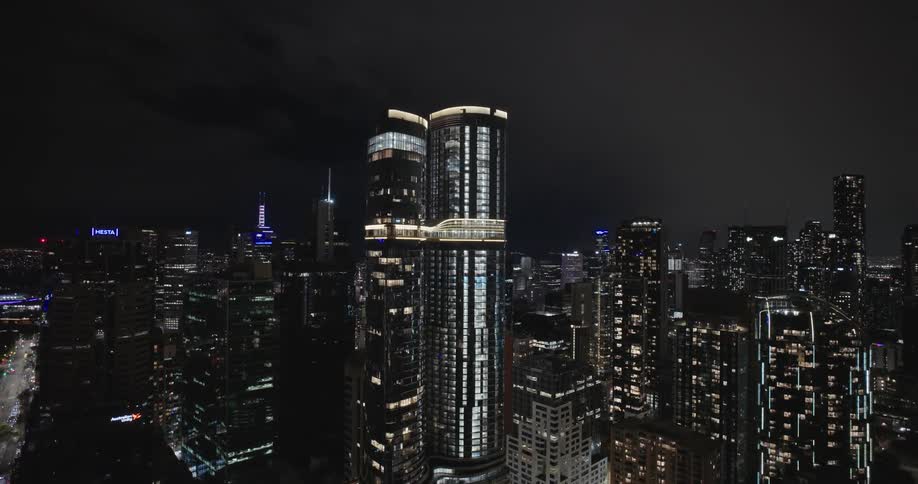 Aerial view of a metropolis with a focus on skyscrapers at night