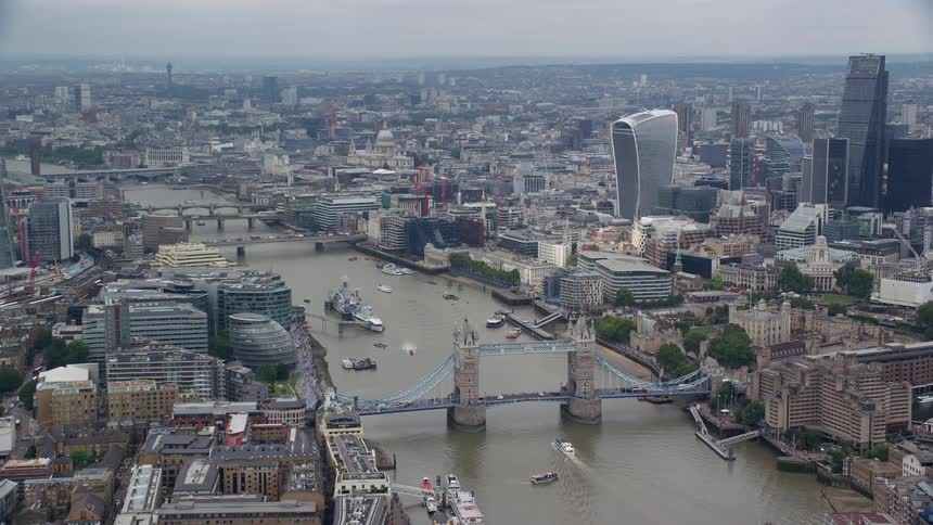 Aerial view of a metropolis by the lakeside with bridges and buildings