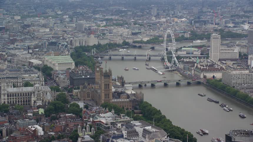 Aerial of buildings bridges and waterway in a metropolitan area