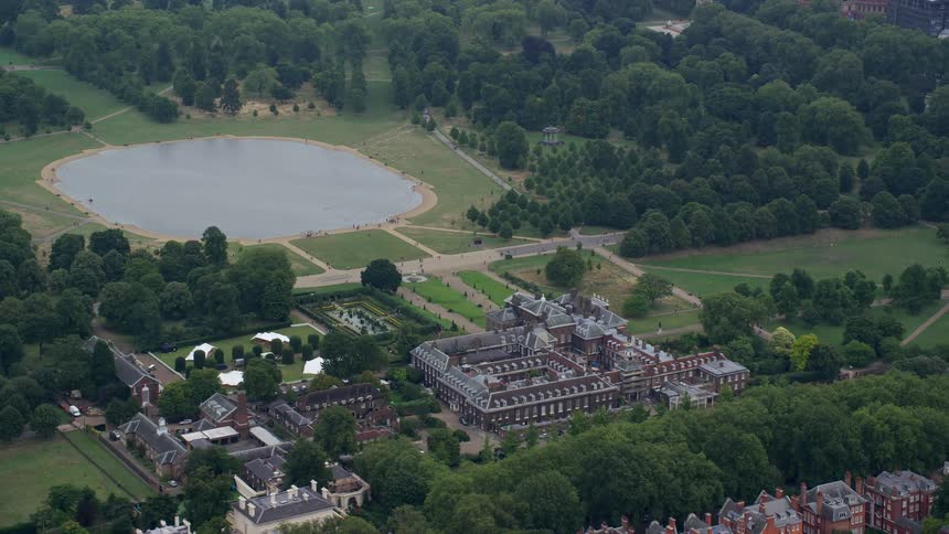Trees separate pond and building complexes from city