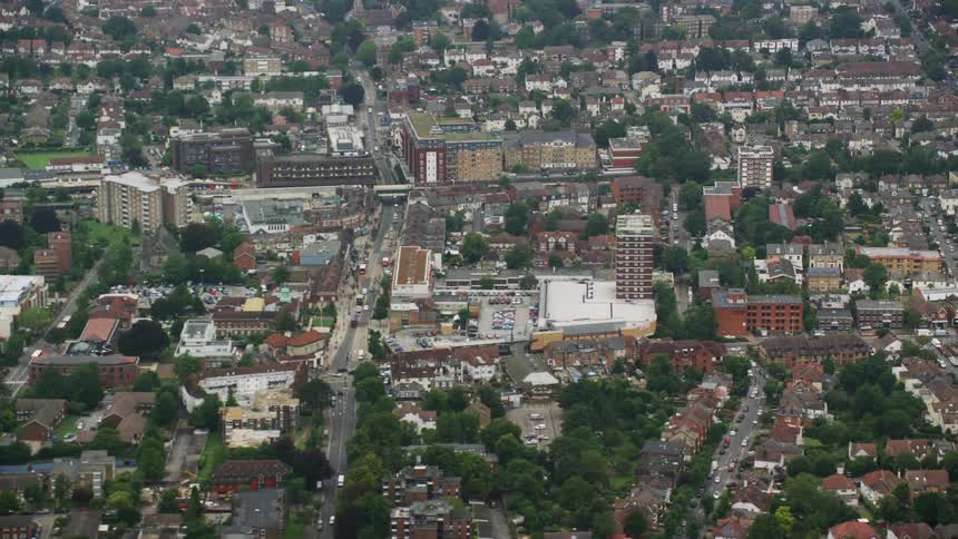 Aerial of large city with highrise and residential buildings