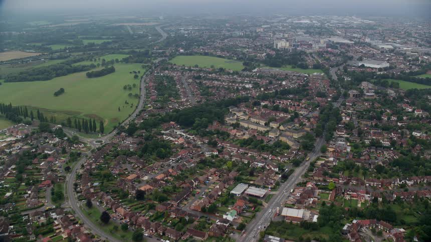 Aerial view of a residential area with multiple green spaces
