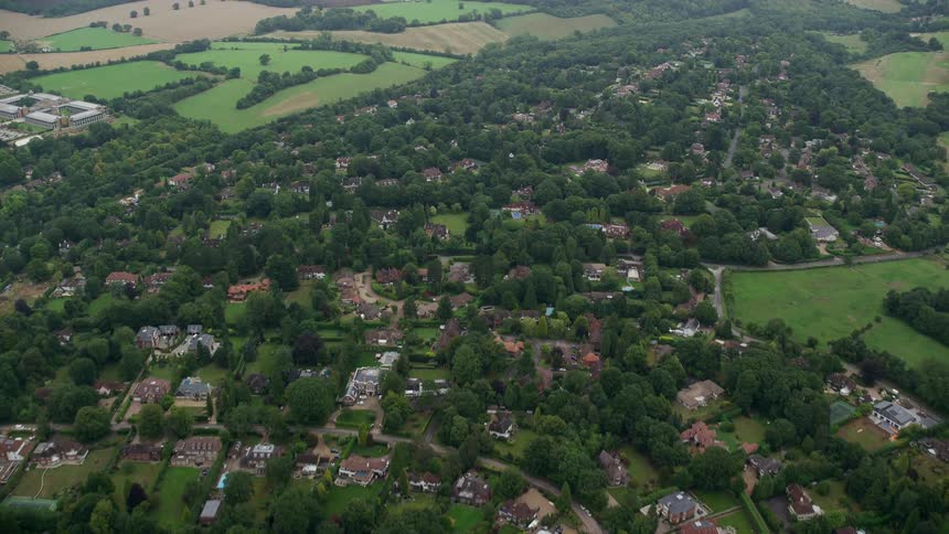 Aerial view of a residential neighborhood with green areas