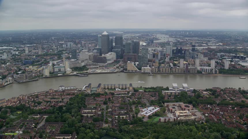 Aerial view of a city by the lakeside with bridges and buildings