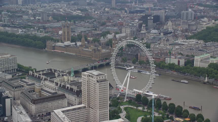 Aerial view of the metropolitan city with a ferris wheel near the port