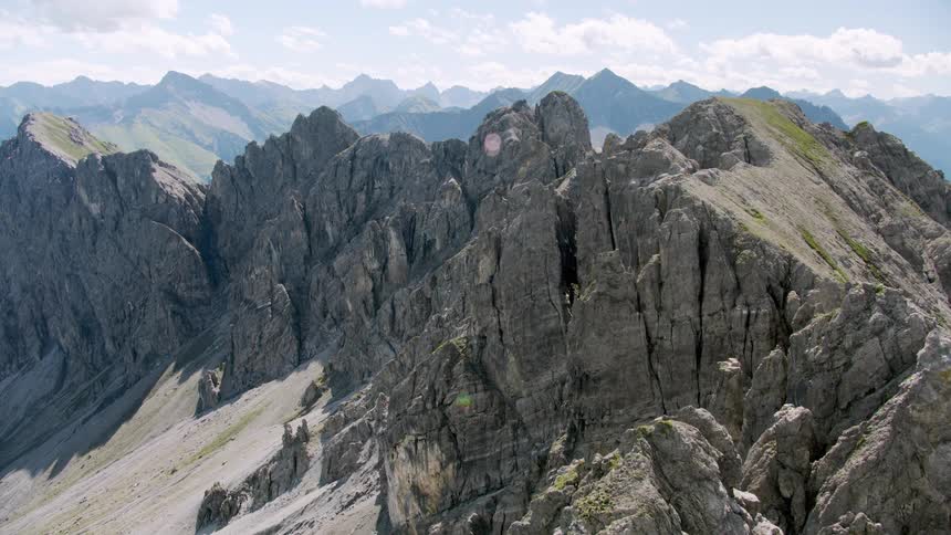 The mountain peak is covered with grass