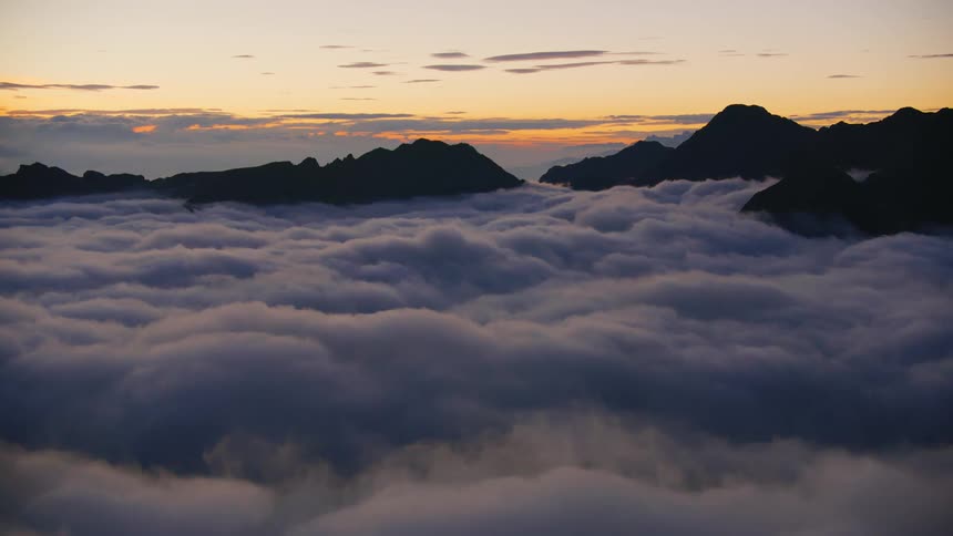 The clouds are touching the mountain top