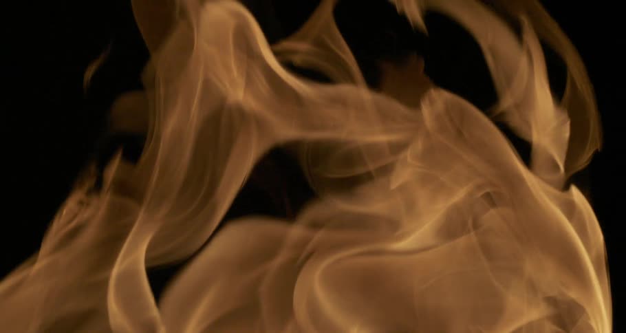 A flame rippling in the dark