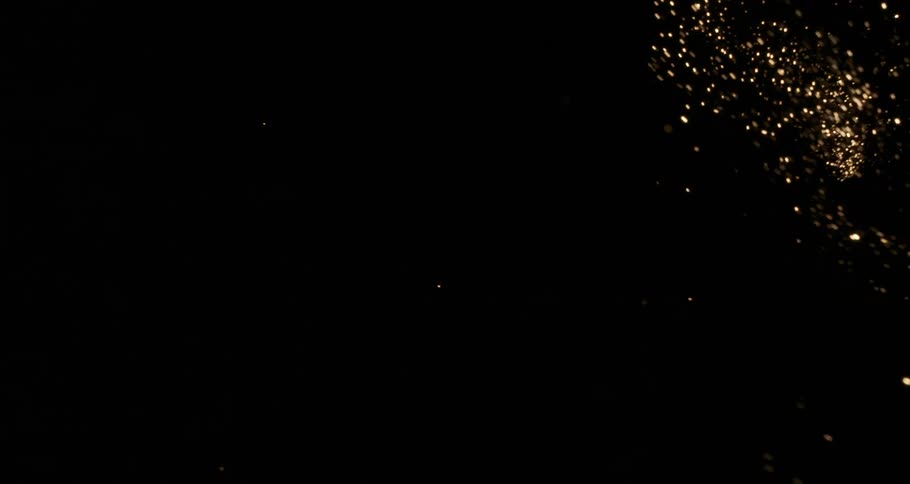 Waves of sparks released from a rippling flame