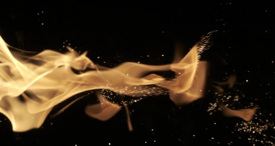 A lot of sparks of fire and a flame heading towards the right
