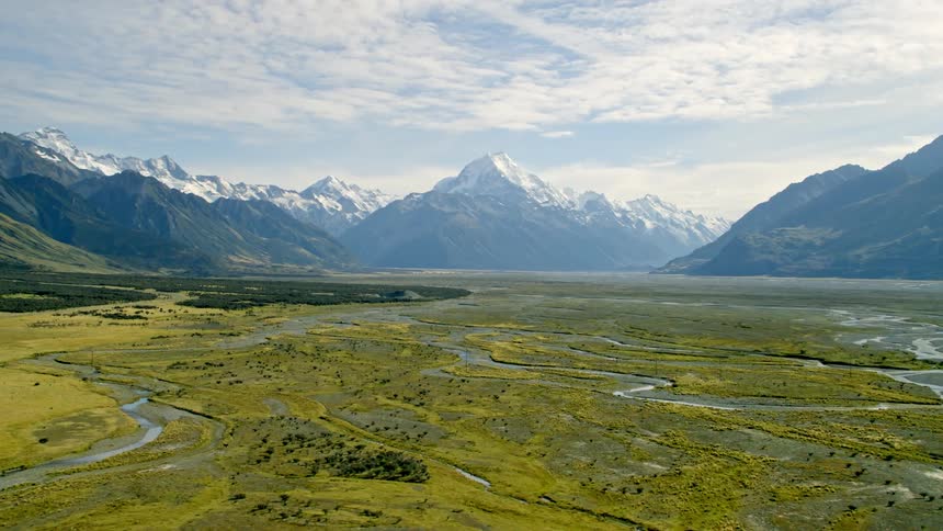 Braided river leads to the enormous mountains