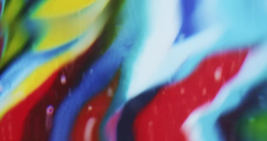 Rippling water reflects multicolored pattern