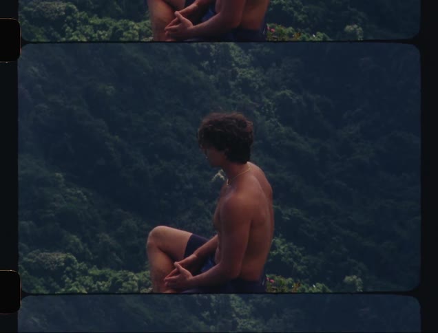 A man in nature meditating on the mountain