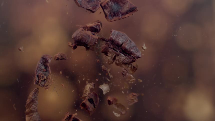 Roasted coffee bean being crushed
