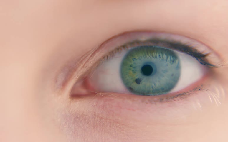 A human eye with a green iris