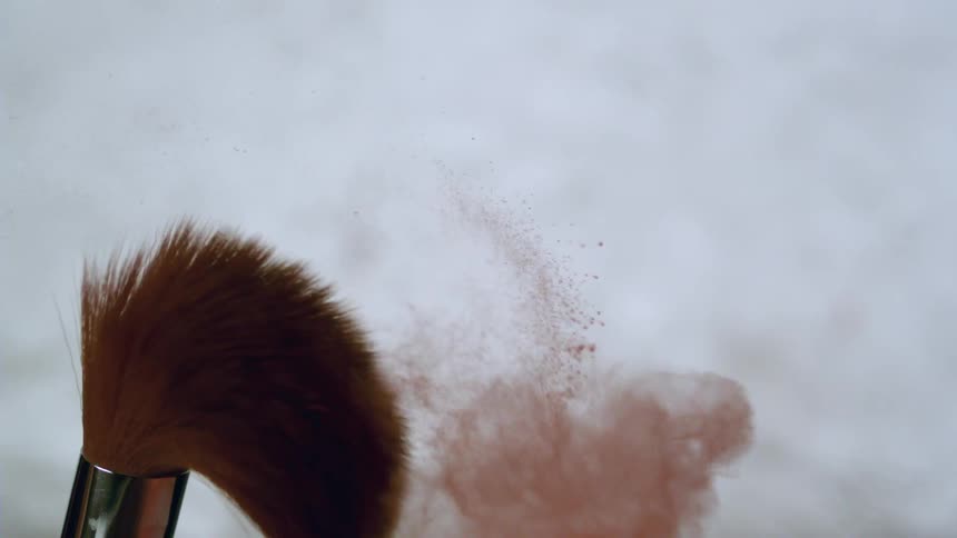 Make up brush spills red dust